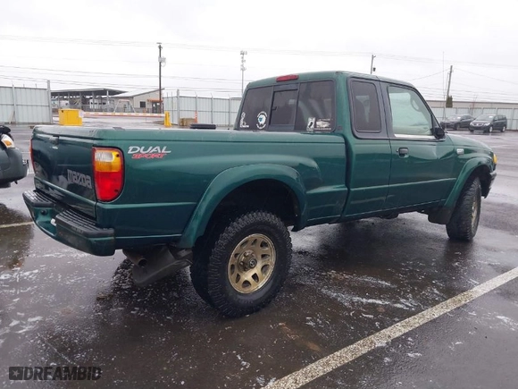 2001 Mazda B-Series 2WD Truck DS with VIN 4F4YR16U61TM24122, listed as a IAAI auction lot 41478933 with 123,732 mi miles. Bid and sale history available at carsss.com. Image 4.