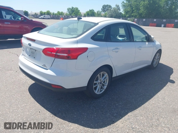 2015 Ford Focus SE z VIN 1FADP3F28FL334359, wystawiony jako IAAI lot #42520827 z przebiegiem 182 755 mil mil oraz . Historia ofert i sprzedaży dostępna na DreamBid. Obrazek 4.