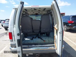 1999 Ford Econoline Cargo Recreational with VIN 1FDRE14L2XHA41059, listed as a IAAI auction lot 42067879 with 149,185 mi miles. Bid and sale history available at carsss.com. Image 19.