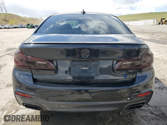 2018 BMW 5 Series M550i xDrive with VIN WBAJB9C55JB049384, listed as a Copart auction lot 54934435 with 79,061 mi miles and Non Repairable. Bid and sale history available at DreamBid. Image 6.