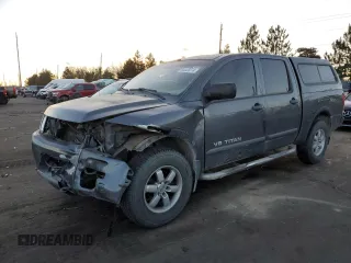 2012 Nissan Titan S with VIN 1N6AA0EC0CN325059, listed as a Copart auction lot 84828374 with 148,856 mi miles and Salvage Title. Bid and sale history available at carsss.com. Image 1.