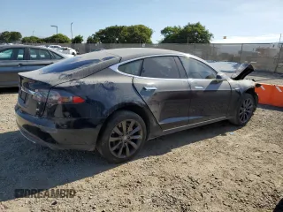 2014 Tesla Model S 60 with VIN 5YJSA1H13EFP38425, listed as a Copart auction lot 63686205 with 183,968 mi miles and Salvage title. Bid and sale history available at DreamBid. Image 3.