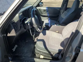 2000 Jeep Cherokee z VIN 1J4FF48S0YL142309, wystawiony jako Copart lot #46277785 z przebiegiem 148 966 mil mil oraz Nie do naprawy • Non repairable. Historia ofert i sprzedaży dostępna na DreamBid. Obrazek 7.