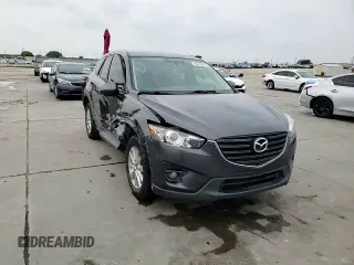 2016 Mazda CX-5 Touring z VIN JM3KE2CY7G0654292, wystawiony jako Copart lot #53433745 z przebiegiem 168 273 mil mil oraz Szkoda całkowita • Salvage title. Historia ofert i sprzedaży dostępna na DreamBid. Obrazek 14.