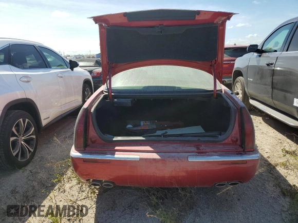 2000 Cadillac Eldorado z VIN 1G6EL12Y7YU198685, wystawiony jako Copart lot #75093094 z przebiegiem Nie podano mil oraz Szkoda całkowita • Salvage title. Historia ofert i sprzedaży dostępna na DreamBid. Obrazek 6.