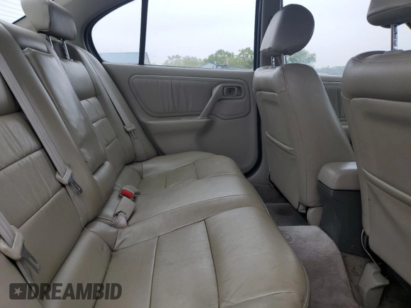 2000 Infiniti G20 Luxury z VIN JNKCP11A1YT304887, wystawiony jako Copart lot #74562724 z przebiegiem 202 140 mil mil oraz Czysty tytuł • Clean title. Historia ofert i sprzedaży dostępna na DreamBid. Obrazek 10.