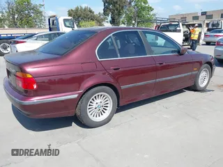 1998 BMW 5 Series 540iA with VIN WBADE6325WBW59821, listed as a IAAI auction lot 42063032 with 199,693 mi miles. Bid and sale history available at carsss.com. Image 4.