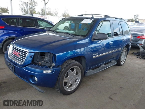 2006 GMC Envoy SLE with VIN 1GKDS13S562252049, listed as a IAAI auction lot 41940052 with 149,445 mi miles. Bid and sale history available at carsss.com. Image 18.