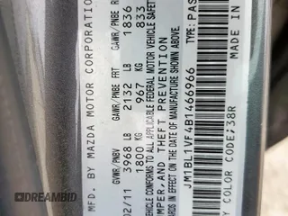 2011 Mazda 3 i Touring z VIN JM1BL1VF4B1466966, wystawiony jako Copart lot #57783245 z przebiegiem 154 806 mil mil oraz Szkoda całkowita • Salvage title. Historia ofert i sprzedaży dostępna na DreamBid. Obrazek 12.