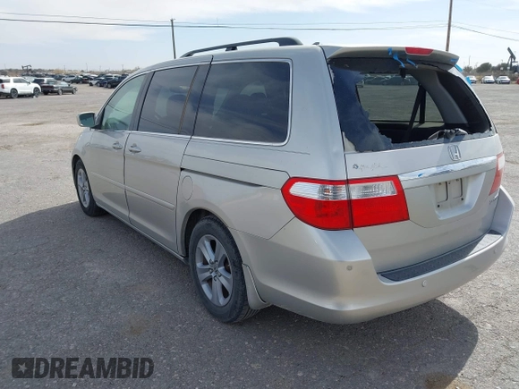 2005 Honda Odyssey TOURING with VIN 5FNRL38895B060605, listed as a IAAI auction lot 41809330 with 228,487 mi miles. Bid and sale history available at carsss.com. Image 3.