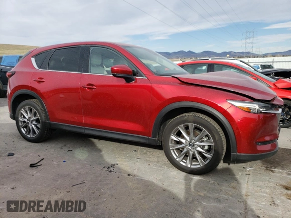 2021 Mazda CX-5 Grand Touring Reserve with VIN JM3KFBAY4M0358478, listed as a Copart auction lot 50839815 with 84,932 mi miles and Salvage Title. Bid and sale history available at DreamBid. Image 4.
