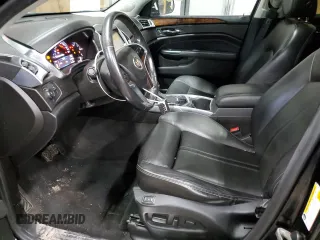 2014 Cadillac SRX Performance Collection z VIN 3GYFNFE31ES627978, wystawiony jako Copart lot #55437185 z przebiegiem 141 759 mil mil oraz Czysty tytuł • Clean title. Historia ofert i sprzedaży dostępna na DreamBid. Obrazek 7.