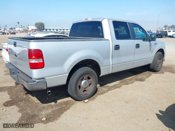 2005 Ford F-150 XLT with VIN 1FTPW12595FB54061, listed as a IAAI auction lot 41872078 with 174,399 mi miles. Bid and sale history available at carsss.com. Image 4.