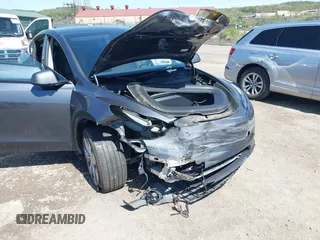 2023 Tesla Model Y Long Range z VIN 7SAYGDEE8PA191415, wystawiony jako IAAI lot #42155577 z przebiegiem 42 149 mil mil oraz . Historia ofert i sprzedaży dostępna na DreamBid. Obrazek 6.