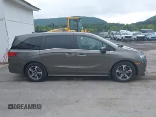 2018 Honda Odyssey Touring with VIN 5FNRL6H89JB057148, listed as a IAAI auction lot 42511909 with 166,438 mi miles and . Bid and sale history available at DreamBid. Image 13.