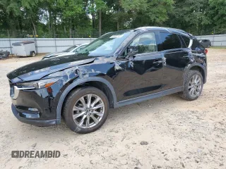 2021 Mazda CX-5 Grand Touring z VIN JM3KFADM7M1399619, wystawiony jako Copart lot #63968155 z przebiegiem 42 102 mil mil oraz Szkoda całkowita • Salvage title. Historia ofert i sprzedaży dostępna na DreamBid. Obrazek 1.