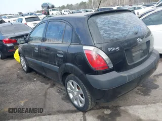 2009 Kia Rio LX with VIN KNADE243296481394, listed as a IAAI auction lot 41498863 with 59,222 mi miles. Bid and sale history available at carsss.com. Image 3.