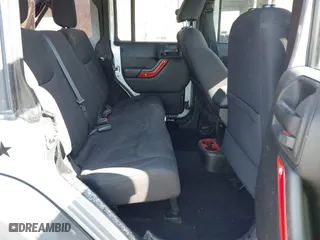 2015 Jeep Wrangler Unlimited Sport with VIN 1C4BJWDG7FL587014, listed as a IAAI auction lot 40641034 with 81,045 mi miles. Bid and sale history available at carsss.com. Image 8.