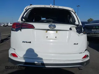 2018 Toyota RAV4 XLE with VIN 2T3WFREV3JW484955, listed as a IAAI auction lot 42262089 with 118,527 mi miles and . Bid and sale history available at DreamBid. Image 17.