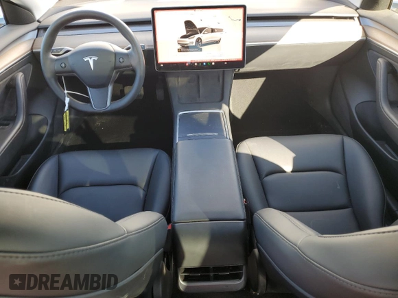 2023 Tesla Model 3 with VIN 5YJ3E1EA7PF557358, listed as a Copart auction lot 48891985 with 20,673 mi miles and Salvage title. Bid and sale history available at DreamBid. Image 8.
