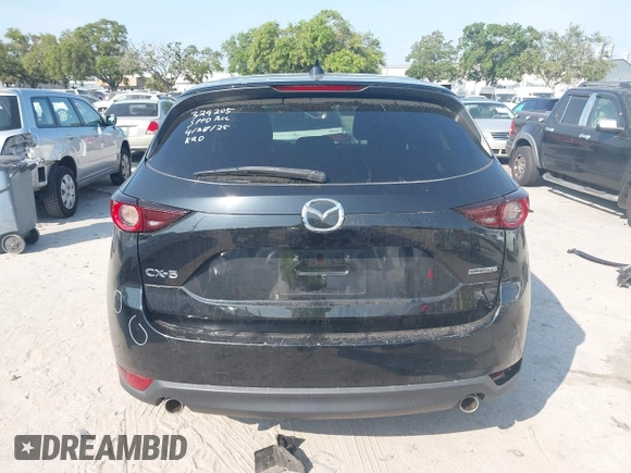 2020 Mazda CX-5 Touring with VIN JM3KFACM2L0770241, listed as a IAAI auction lot 42186952 with 41,590 mi miles and . Bid and sale history available at DreamBid. Image 17.