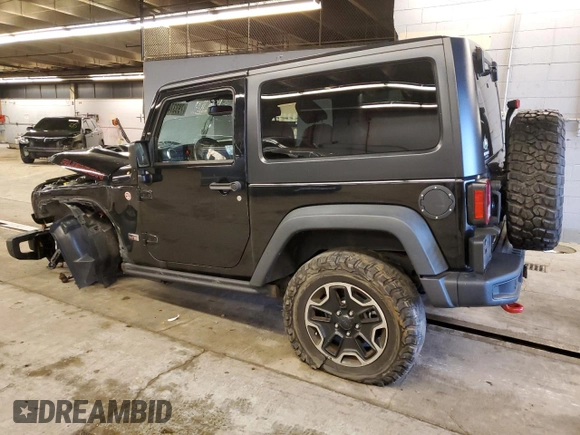 2013 Jeep Wrangler Rubicon with VIN 1C4HJWCG6DL666540, listed as a Copart auction lot 79337404 with 130,448 mi miles and Salvage title. Bid and sale history available at DreamBid. Image 2.