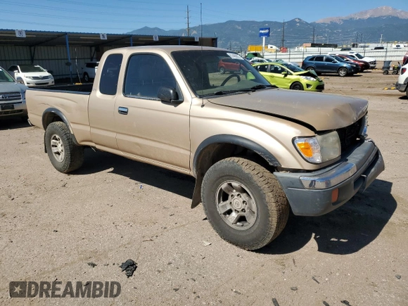 1999 Toyota Tacoma with VIN 4TAWN72N4XZ560411, listed as a Copart auction lot 61499925 with 395,215 mi miles and Salvage title. Bid and sale history available at DreamBid. Image 4.