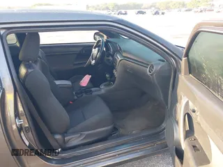 2012 Scion tC with VIN JTKJF5C74C3026945, listed as a IAAI auction lot 41757437 with 104,039 mi miles. Bid and sale history available at carsss.com. Image 5.