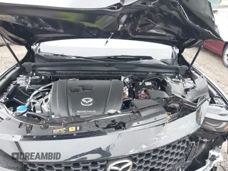 2024 Mazda CX-50 S Select with VIN 7MMVABAM9RN235769, listed as a IAAI auction lot 41183413 with 972 mi miles and . Bid and sale history available at DreamBid. Image 10.
