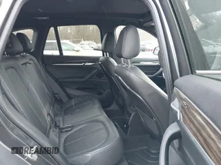 2017 BMW X1 xDrive28i with VIN WBXHT3C35H5F74213, listed as a IAAI auction lot 41589180 with 58,990 mi miles. Bid and sale history available at carsss.com. Image 8.