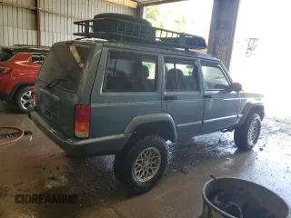 1998 Jeep Cherokee Country with VIN 1J4FT78S8WL252502, listed as a Copart auction lot 59664545 with 133,148 mi miles and Salvage title. Bid and sale history available at DreamBid. Image 3.