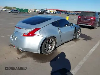 2014 Nissan 370Z Nismo with VIN JN1AZ4EHXEM634418, listed as a IAAI auction lot 41308580 with 84,074 mi miles and . Bid and sale history available at DreamBid. Image 4.
