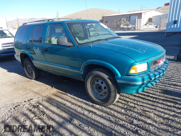 1996 GMC Jimmy SL z VIN 1GKDT13W6T2505181, wystawiony jako IAAI lot #41392669 z przebiegiem 213 728 mil mil oraz . Historia ofert i sprzedaży dostępna na DreamBid. Obrazek 1.