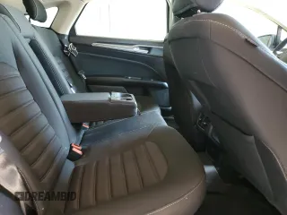 2018 Ford Fusion SE z VIN 3FA6P0HDXJR130677, wystawiony jako Copart lot #51737345 z przebiegiem 129 918 mil mil oraz Szkoda całkowita • Salvage title. Historia ofert i sprzedaży dostępna na DreamBid. Obrazek 11.