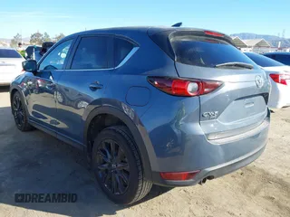 2021 Mazda CX-5 Touring with VIN JM3KFBCM9M0434433, listed as a IAAI auction lot 41425112 with 57,527 mi miles. Bid and sale history available at carsss.com. Image 3.