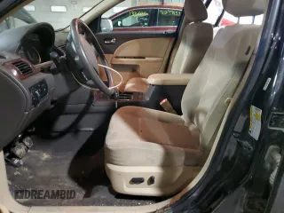 2009 Ford Taurus SEL with VIN 1FAHP27W99G102850, listed as a Copart auction lot 50009975 with 184,829 mi miles and Salvage Title. Bid and sale history available at carsss.com. Image 7.