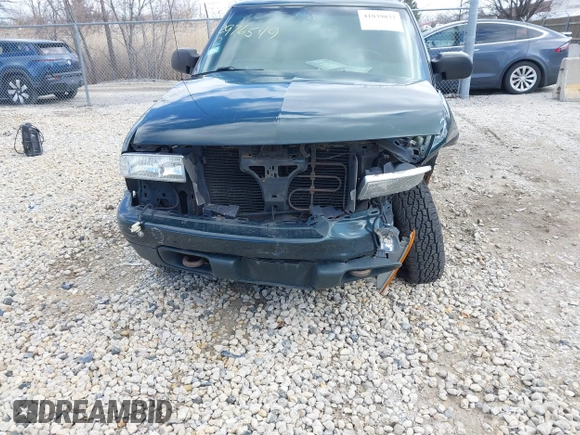 2003 Chevrolet Blazer LS z VIN 1GNDT13X93K177170, wystawiony jako IAAI lot #41839837 z przebiegiem 148 555 mil mil oraz . Historia ofert i sprzedaży dostępna na DreamBid. Obrazek 6.