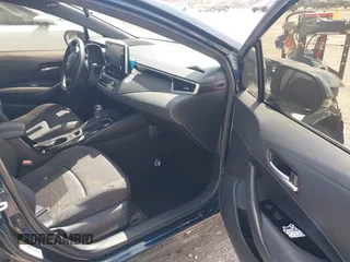 2019 Toyota Corolla Hatchback SE with VIN JTNK4RBE3K3061589, listed as a IAAI auction lot 42123273 with 90,491 mi miles. Bid and sale history available at carsss.com. Image 5.