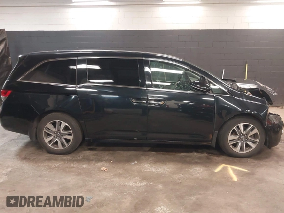 2014 Honda Odyssey Touring with VIN 5FNRL5H94EB105745, listed as a IAAI auction lot 41744012 with 77,032 mi miles and . Bid and sale history available at DreamBid. Image 13.