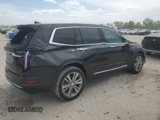2023 Cadillac XT6 FWD Premium Luxury with VIN 1GYKPCRS6PZ127331, listed as a Copart auction lot 52951105 with 47,796 mi miles and Salvage Title. Bid and sale history available at carsss.com. Image 3.
