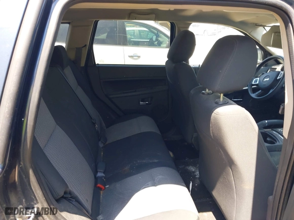 2009 Jeep Grand Cherokee Laredo with VIN 1J8GS48K79C539659, listed as a IAAI auction lot 42063431 with 1 mi miles. Bid and sale history available at carsss.com. Image 8.