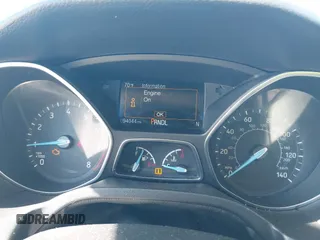2018 Ford Focus SE z VIN 1FADP3F27JL245603, wystawiony jako IAAI lot #41773395 z przebiegiem 94 044 mil mil oraz . Historia ofert i sprzedaży dostępna na DreamBid. Obrazek 7.