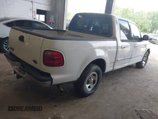 2001 Ford F-150 XLT with VIN 1FTRW07LX1KD77186, listed as a IAAI auction lot 42564774 with 190,647 mi miles and . Bid and sale history available at DreamBid. Image 4.