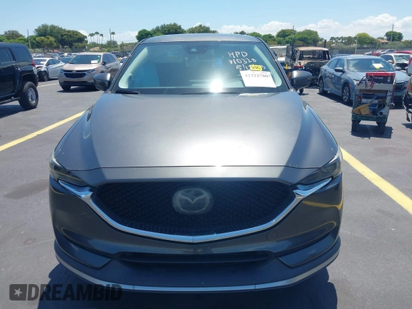 2018 Mazda CX-5 Grand Touring with VIN JM3KFADM8J1310328, listed as a IAAI auction lot 42322780 with 106,378 mi miles and . Bid and sale history available at DreamBid. Image 13.