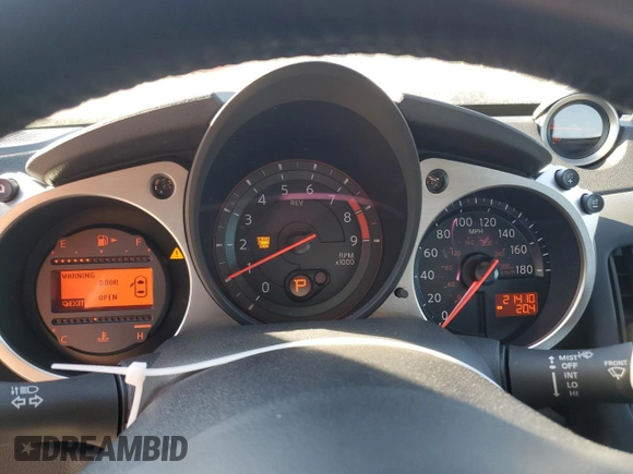 2014 Nissan 370Z Nismo with VIN JN1AZ4EH6EM633797, listed as a Copart auction lot 87879675 with 21,410 mi miles and Salvage Title. Bid and sale history available at DreamBid. Image 9.