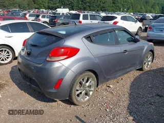 2016 Hyundai Veloster z VIN KMHTC6AD8GU277003, wystawiony jako IAAI lot #42375395 z przebiegiem 166 583 mil mil oraz . Historia ofert i sprzedaży dostępna na DreamBid. Obrazek 4.