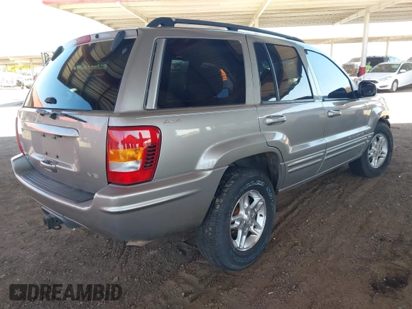 2000 Jeep Grand Cherokee Limited z VIN 1J4GW58N1YC206992, wystawiony jako IAAI lot #42057236 z przebiegiem 183 986 mil mil oraz . Historia ofert i sprzedaży dostępna na DreamBid. Obrazek 4.