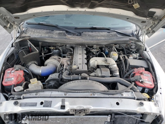 2000 Dodge 2500 z VIN 1B7KF2369YJ144753, wystawiony jako Copart lot #80801414 z przebiegiem 173 413 mil mil oraz Szkoda całkowita • Salvage title. Historia ofert i sprzedaży dostępna na DreamBid. Obrazek 11.