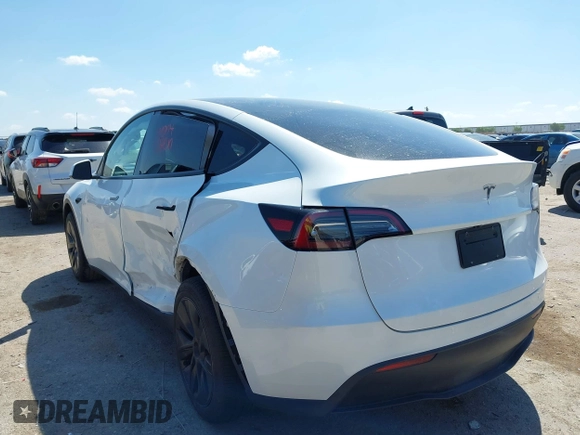 2024 Tesla Model Y with VIN 7SAYGDED0RA327806, listed as a IAAI auction lot 42096752 with 13,244 mi miles and . Bid and sale history available at DreamBid. Image 3.