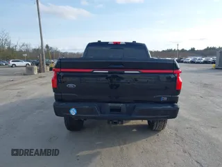 2022 Ford F-150 Lightning Pro z VIN 1FT6W1EV3NWG03970, wystawiony jako IAAI lot #41801986 z przebiegiem 29 815 mil mil oraz . Historia ofert i sprzedaży dostępna na DreamBid. Obrazek 16.